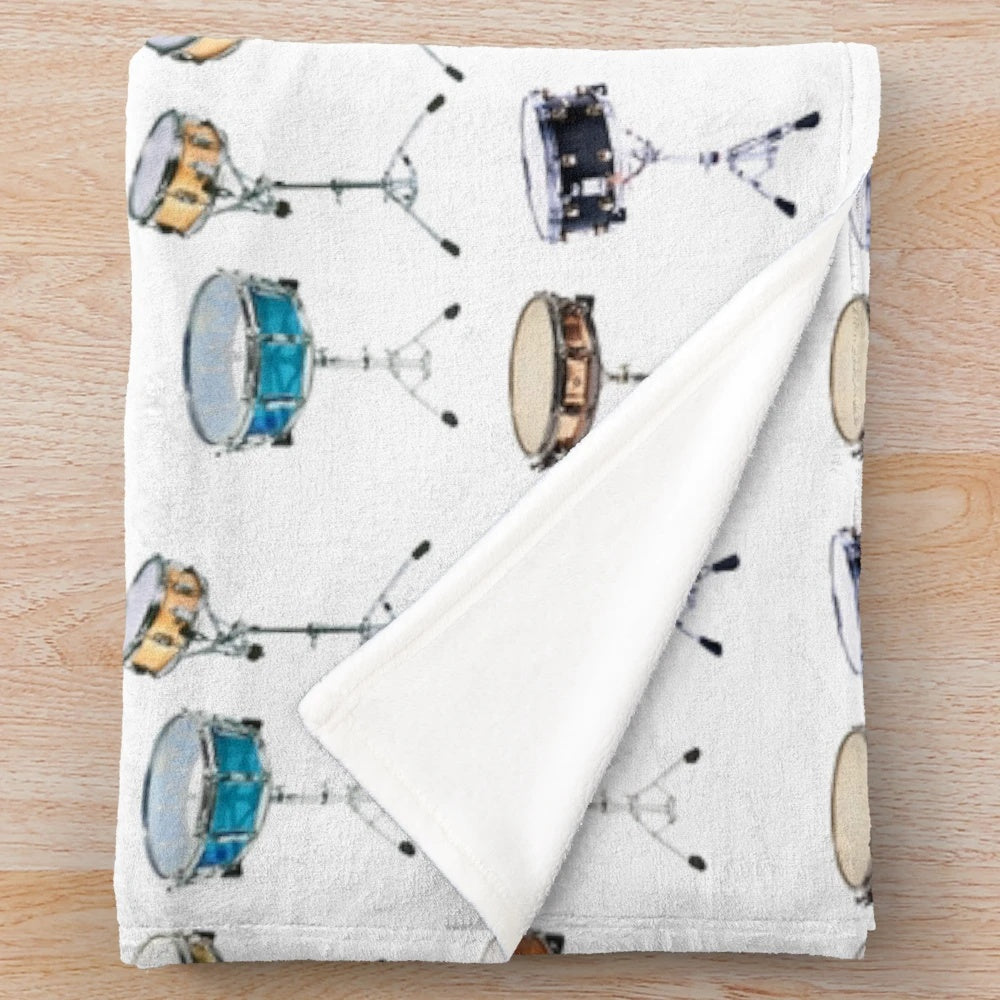 A plush blanket featuring a snare drum percussion pattern design for drummers and music lovers