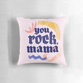 Close-up of a hand-lettered "You rock mama" design on a white pillow.