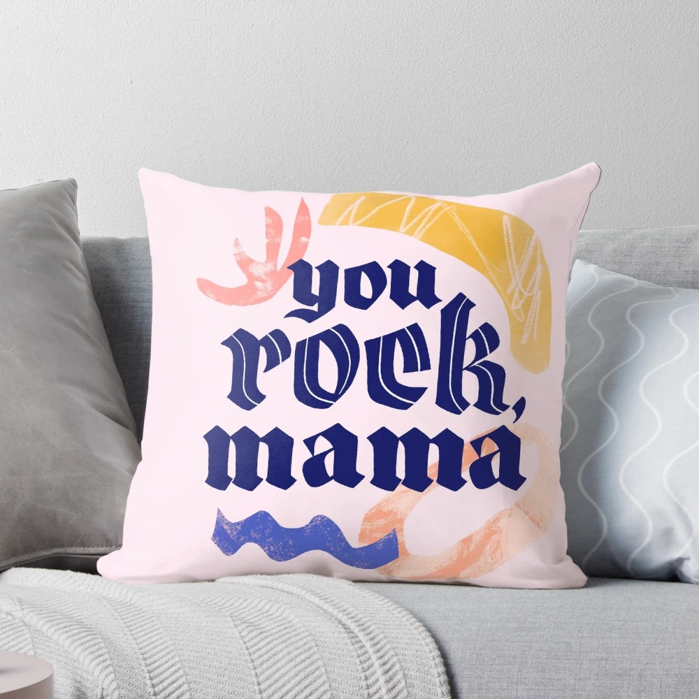 Close-up of a hand-lettered "You rock mama" design on a white pillow.