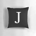 Black and white monogram initial J pillow with a minimalist, classy design.