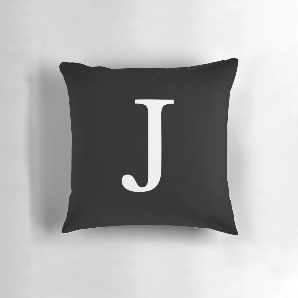 Black and white monogram initial J pillow with a minimalist, classy design.