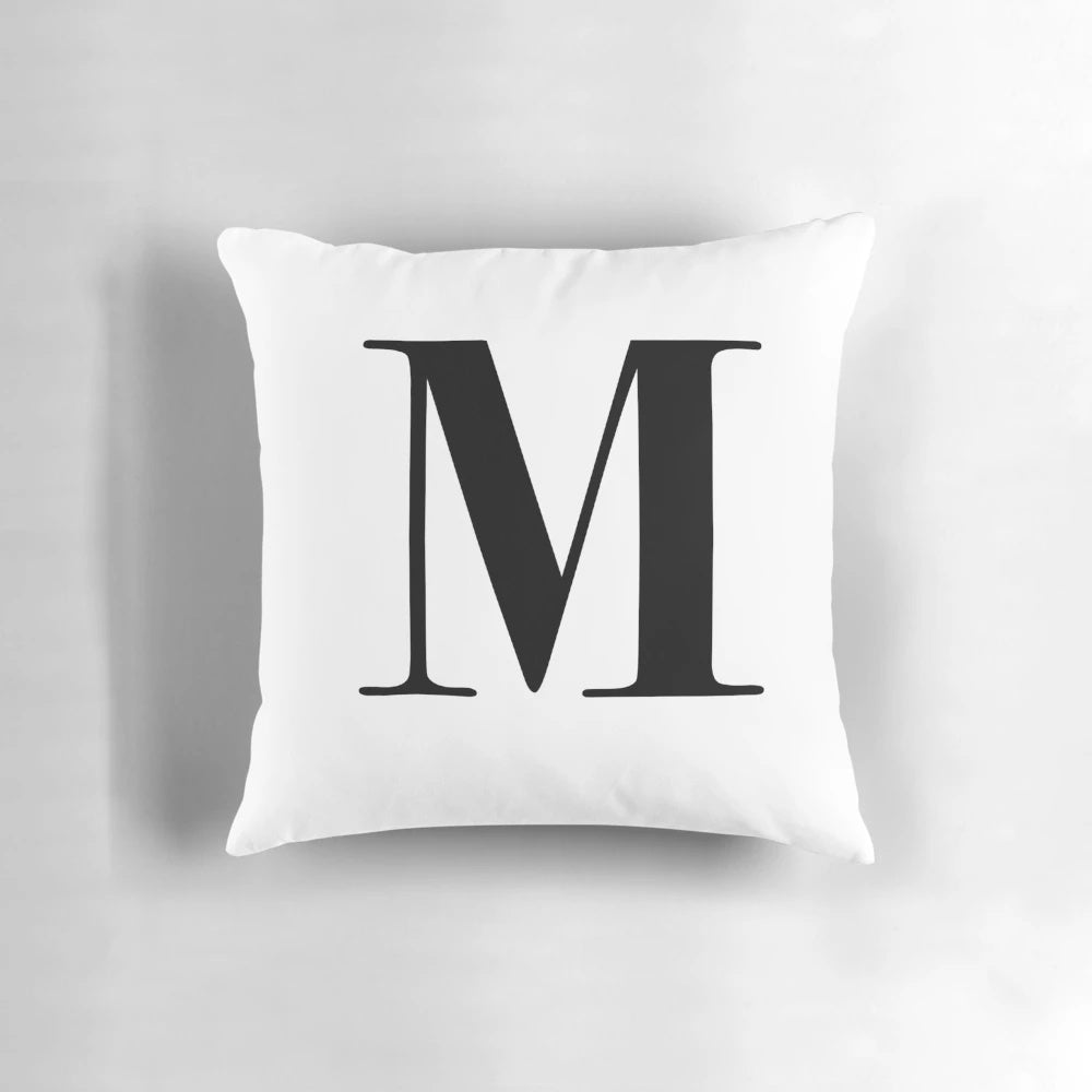 Personalized throw pillow with the letter M in a stylish monogram design