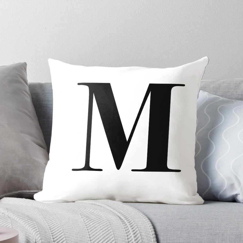 Personalized throw pillow with the letter M in a stylish monogram design