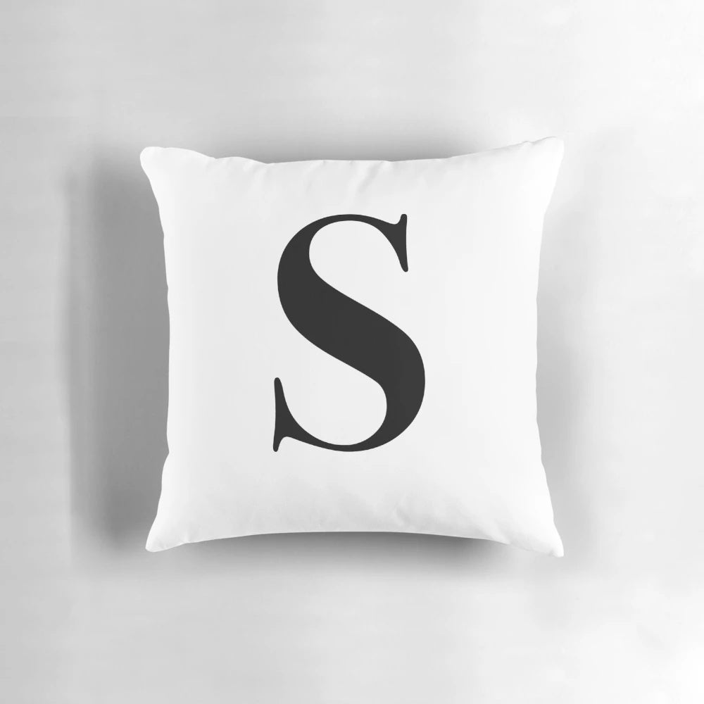 Plush monogram pillow with the letter S, perfect for adding a personal touch to your decor.