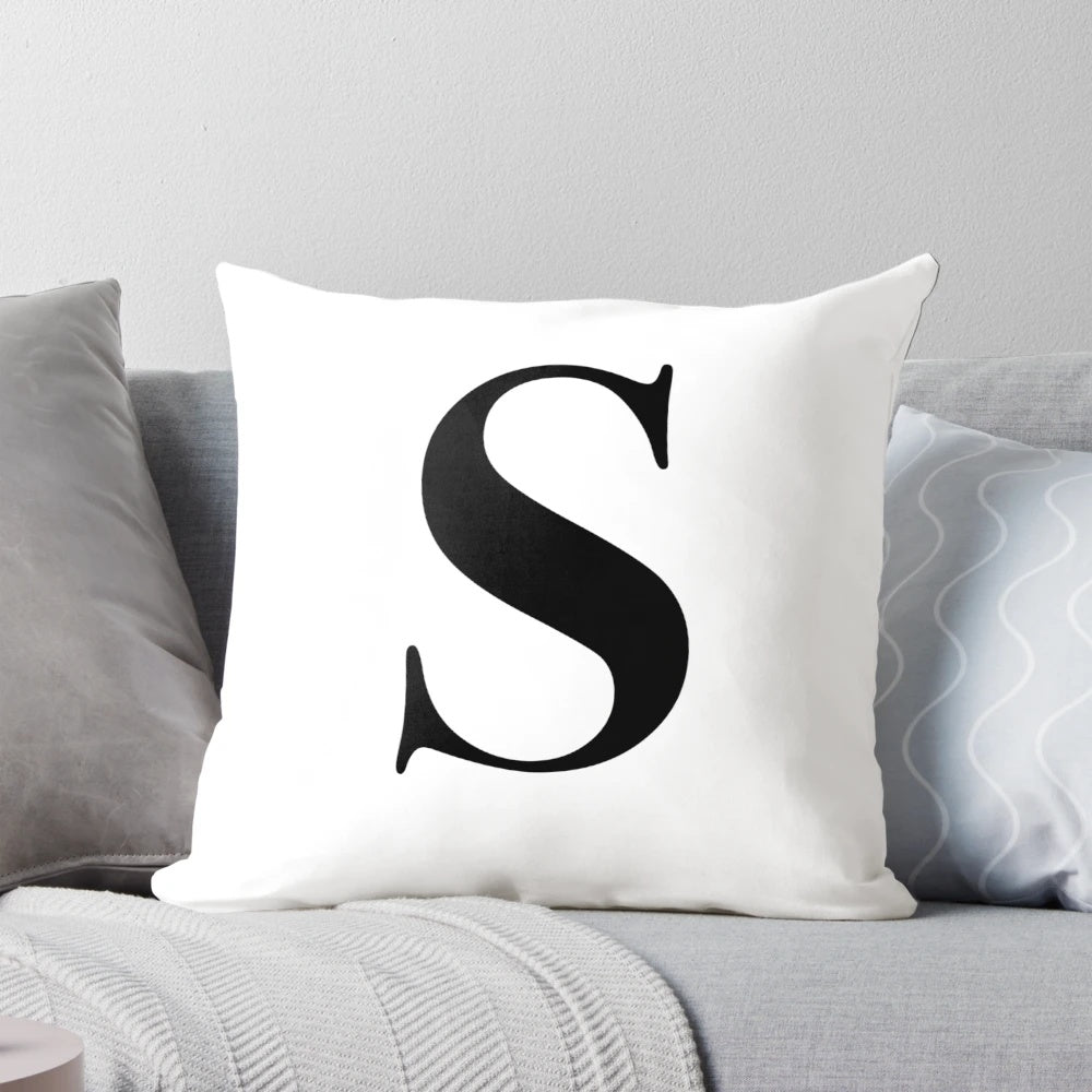 Plush monogram pillow with the letter S, perfect for adding a personal touch to your decor.