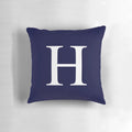 Navy blue and white pillow with monogram H design, ideal for personalized and minimal home decor