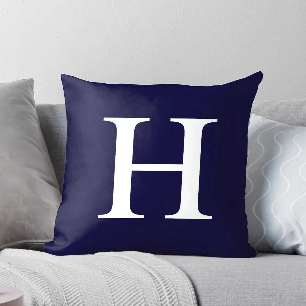Navy blue and white pillow with monogram H design, ideal for personalized and minimal home decor