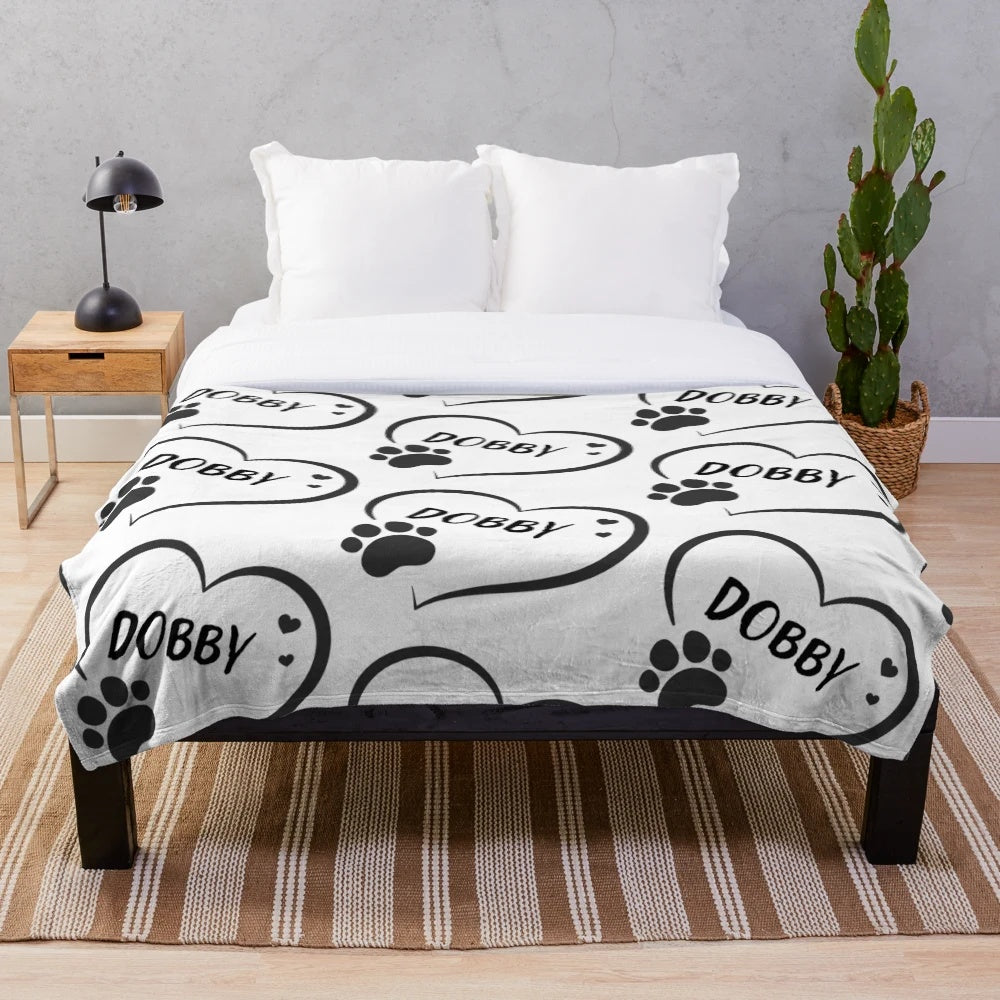 Plush blanket with personalized pet name in a heart with a paw