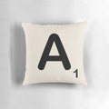 Decorative throw pillow featuring a printed scrabble tile letter design