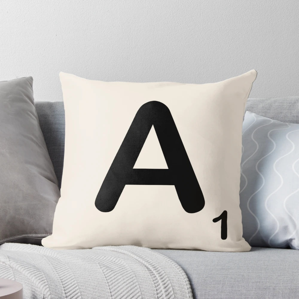 Decorative throw pillow featuring a printed scrabble tile letter design