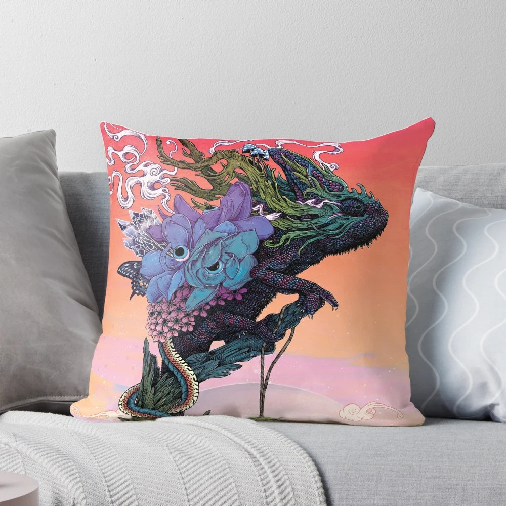 A Phantasmagoria-inspired pillow with a surreal, psychedelic design featuring chameleons, flowers, and a cosmic sunset.