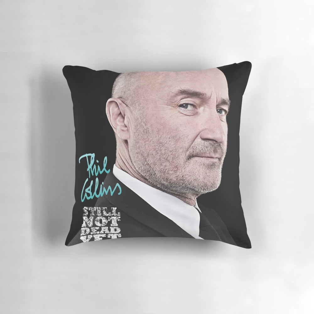 Phil Collins performing live on stage during his "Not Dead Yet" concert tour, featured on a custom throw pillow.