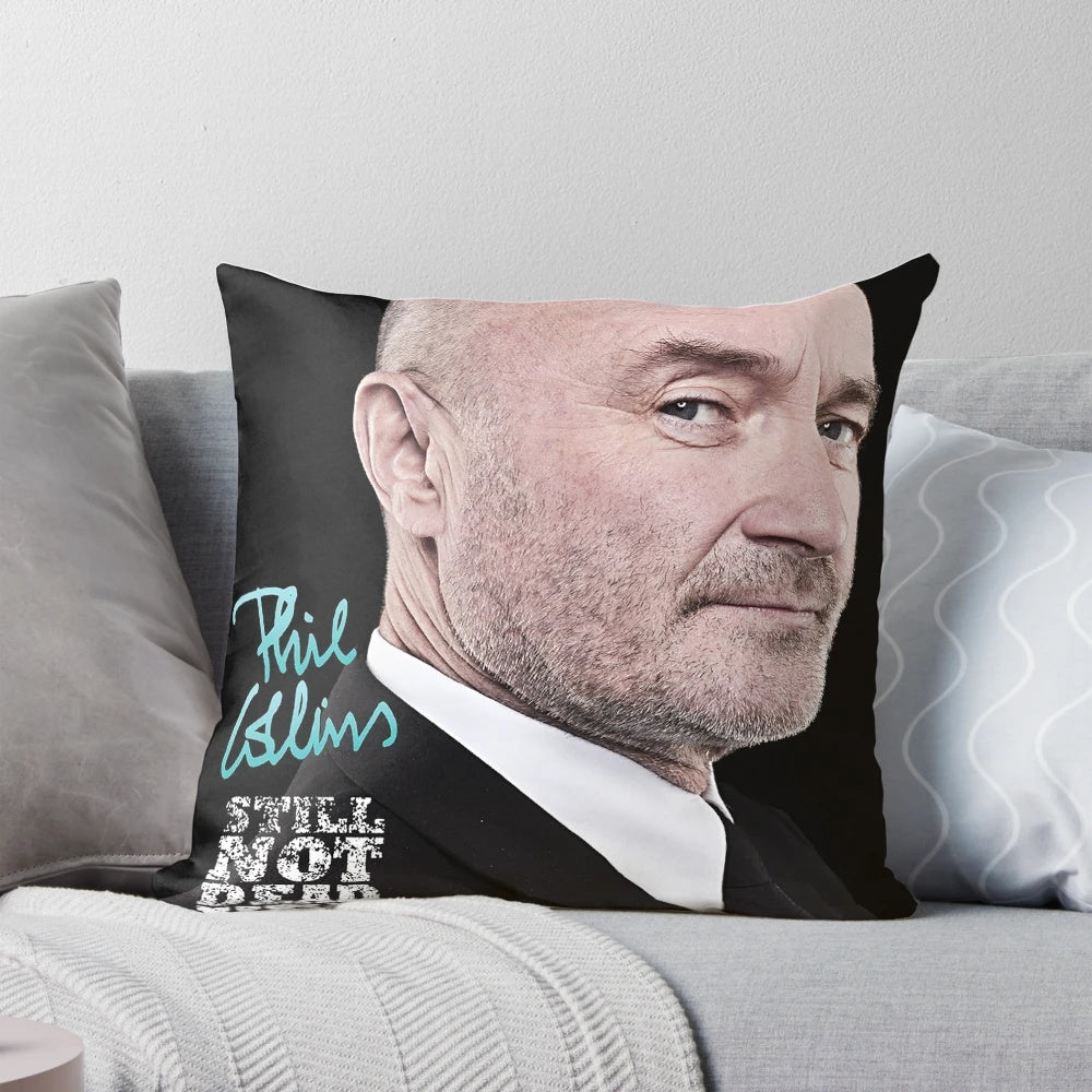 Phil Collins performing live on stage during his "Not Dead Yet" concert tour, featured on a custom throw pillow.