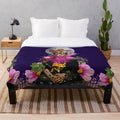Frida Kahlo inspired plush blanket with surreal floral and moon imagery