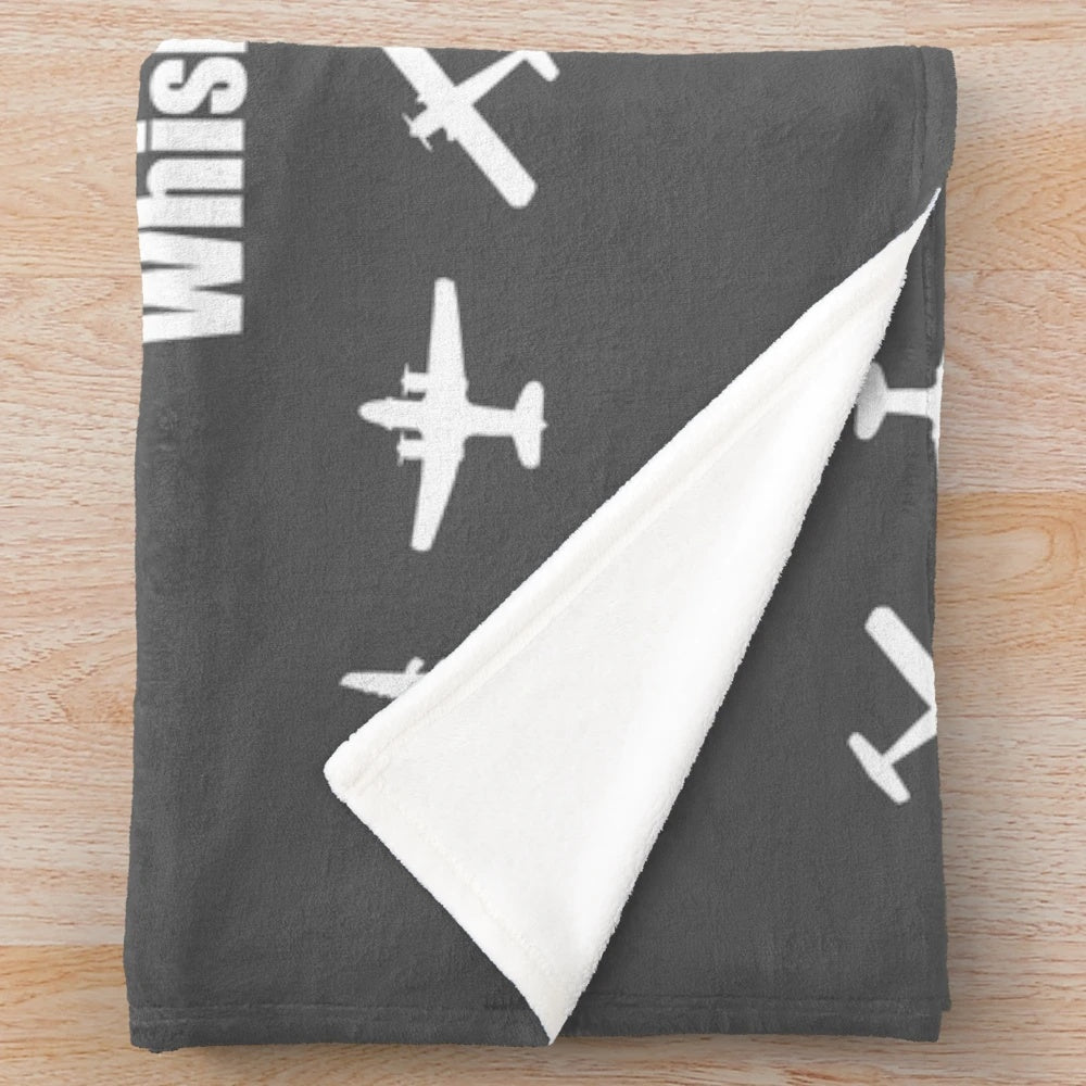Phonetic alphabet plush blanket featuring a white airplane design