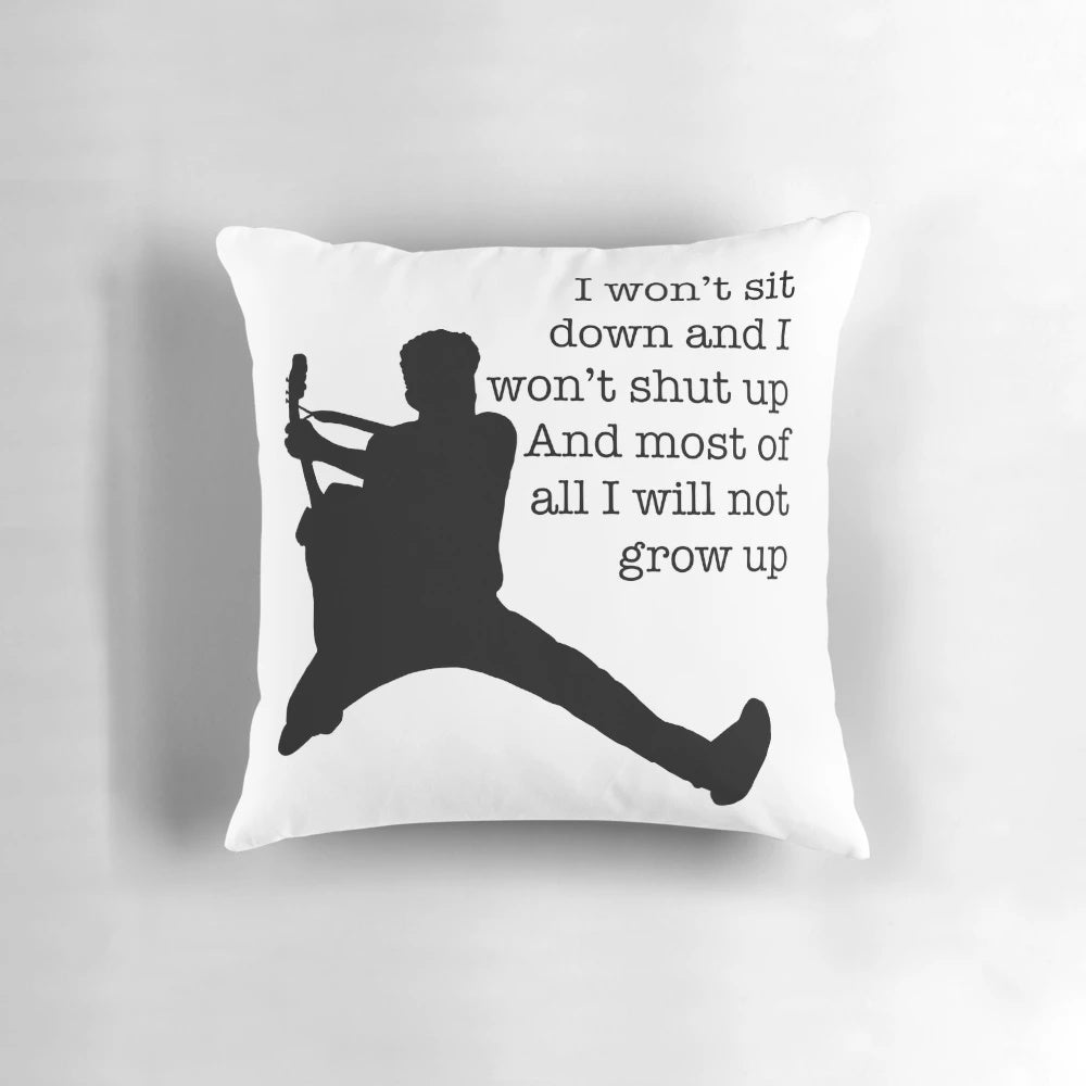 A black and white silhouette throw pillow featuring the lyrics "Photosynthesis" by Frank Turner.