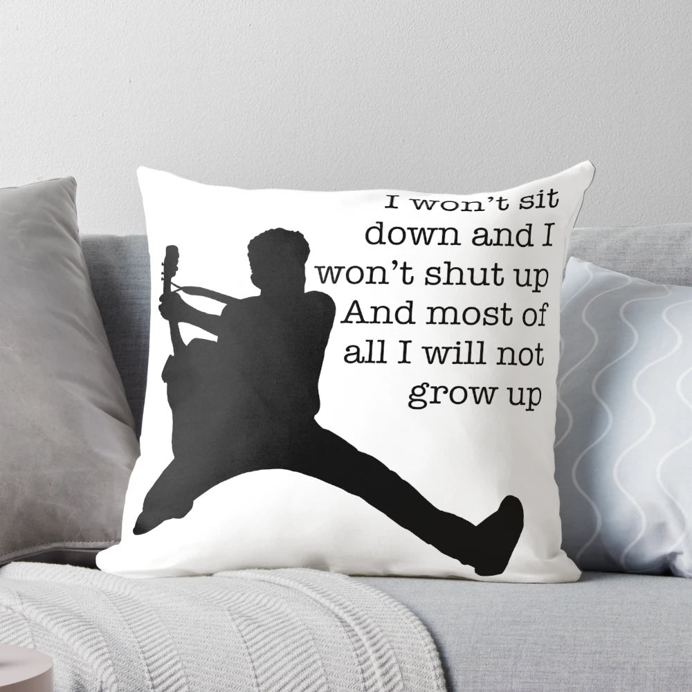 A black and white silhouette throw pillow featuring the lyrics "Photosynthesis" by Frank Turner.