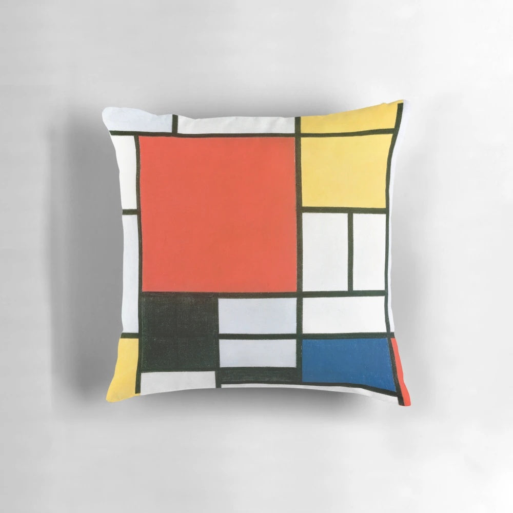 Piet Mondrian inspired abstract geometric pillow with bold red, yellow, blue, and black color composition