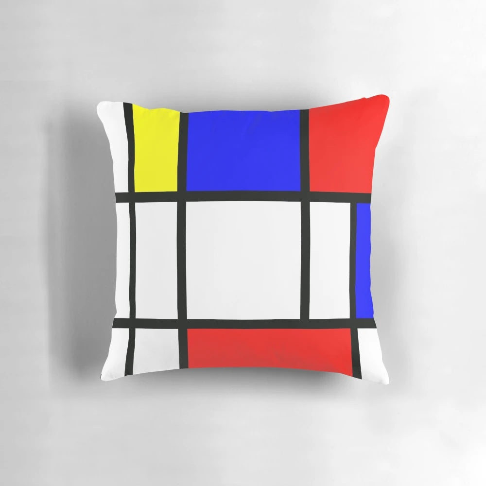 Piet Mondrian inspired color block pillow with red, yellow, and blue geometric patterns.