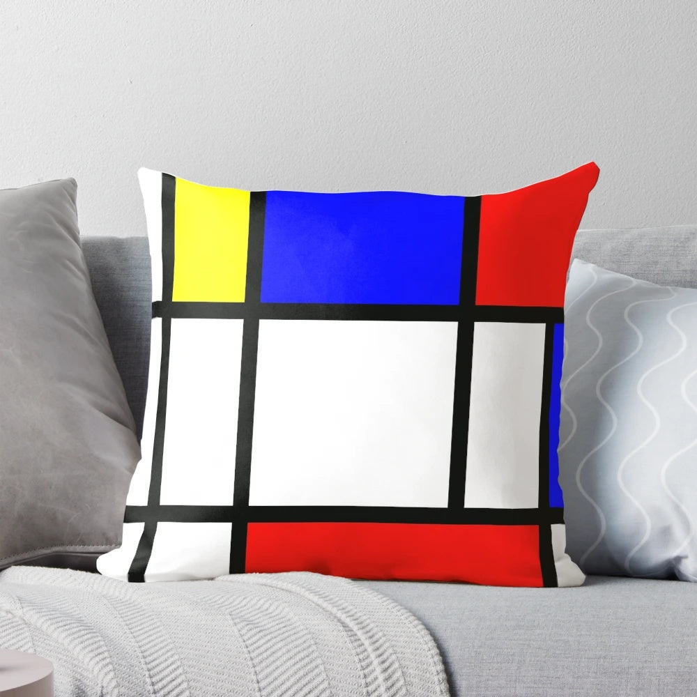 Piet Mondrian inspired color block pillow with red, yellow, and blue geometric patterns.