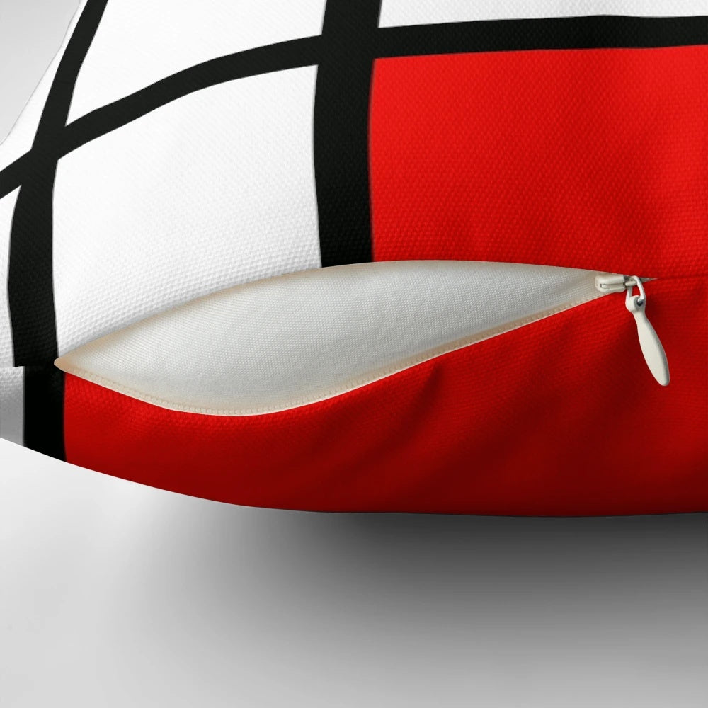 Piet Mondrian inspired color block pillow with red, yellow, and blue geometric patterns.