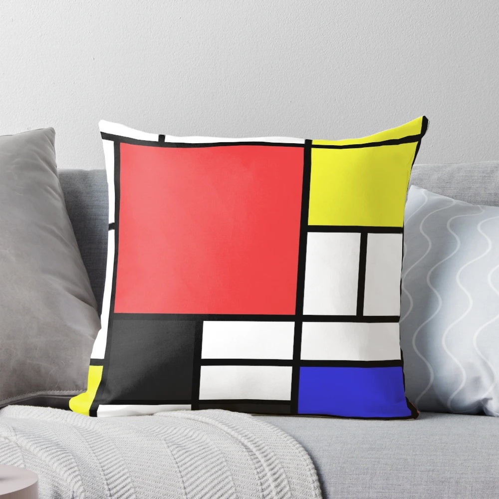 Mondrian-style pillow with black, white, and primary color geometric pattern, inspired by the iconic works of Dutch artist Piet Mondrian.