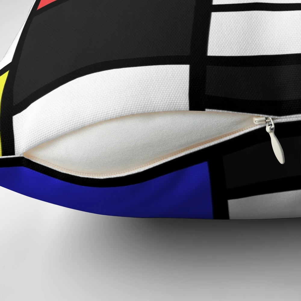 Mondrian-style pillow with black, white, and primary color geometric pattern, inspired by the iconic works of Dutch artist Piet Mondrian.