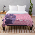 Pink plush blanket featuring a cow design inspired by the character Leon Kennedy from the Resident Evil video game series.