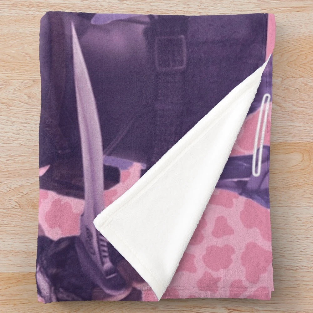 Pink plush blanket featuring a cow design inspired by the character Leon Kennedy from the Resident Evil video game series.