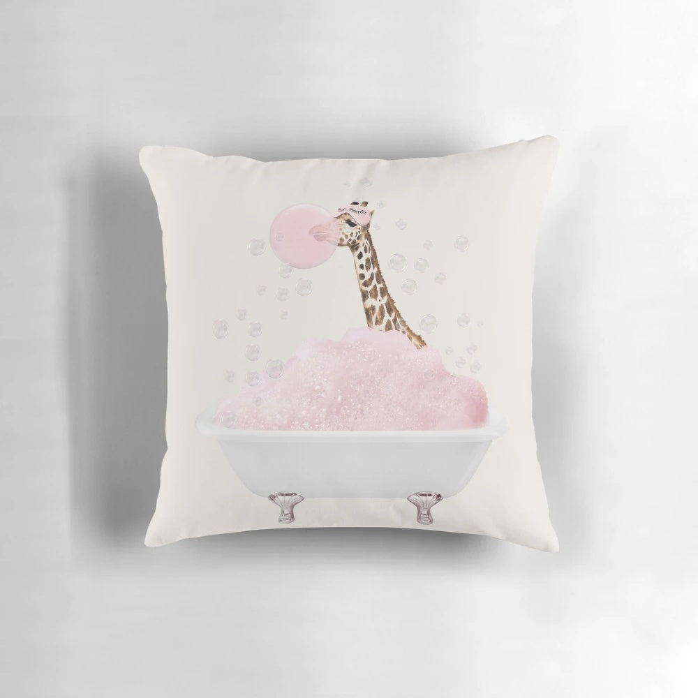 A pink foam pillow featuring a whimsical giraffe taking a bubble bath, perfect for nursery or bathroom decor.