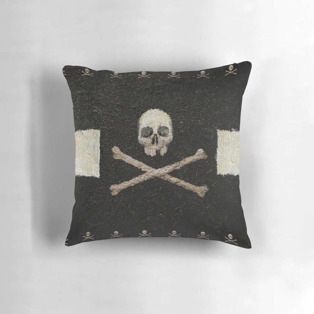 Decorative black and white pillow with a pirate skull graphic design