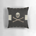Decorative black and white pillow with a pirate skull graphic design