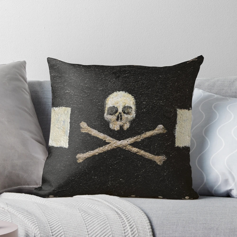 Decorative black and white pillow with a pirate skull graphic design