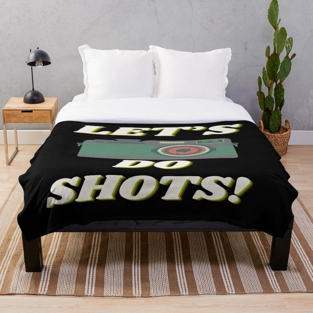 Camera-themed plush blanket with a playful design for photographers and film enthusiasts