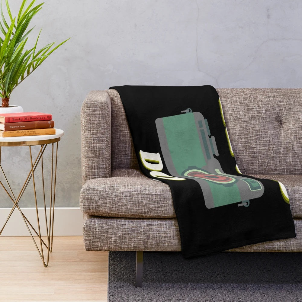 Camera-themed plush blanket with a playful design for photographers and film enthusiasts