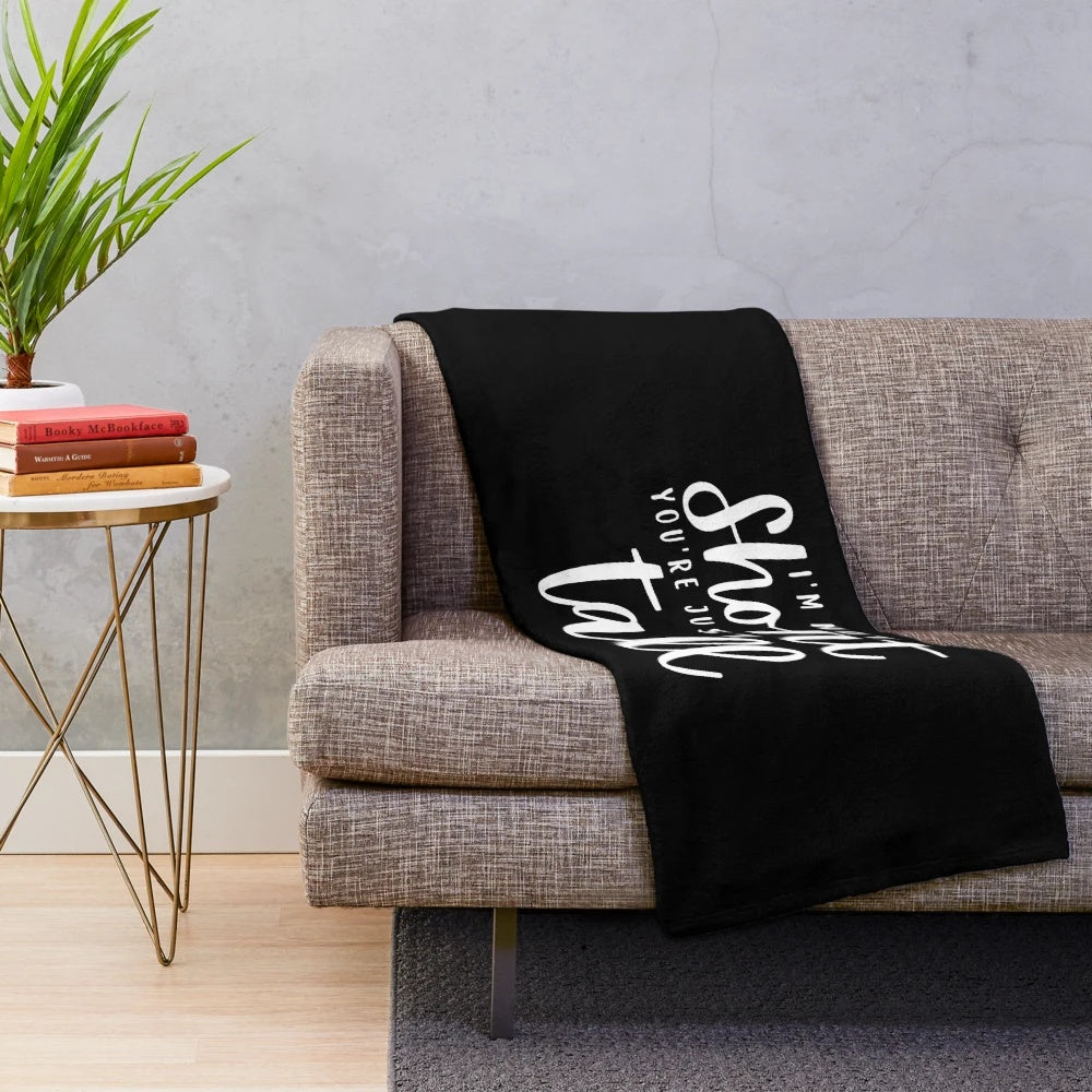 I'm not Short You are just Tall" plush blanket with humorous office-themed design
