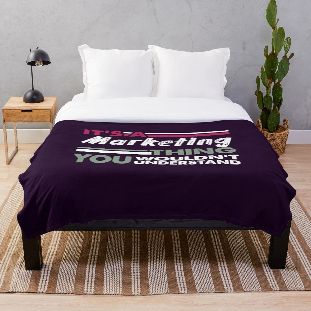 Plush blanket with "It's a Marketing Thing You Wouldn't Understand" text