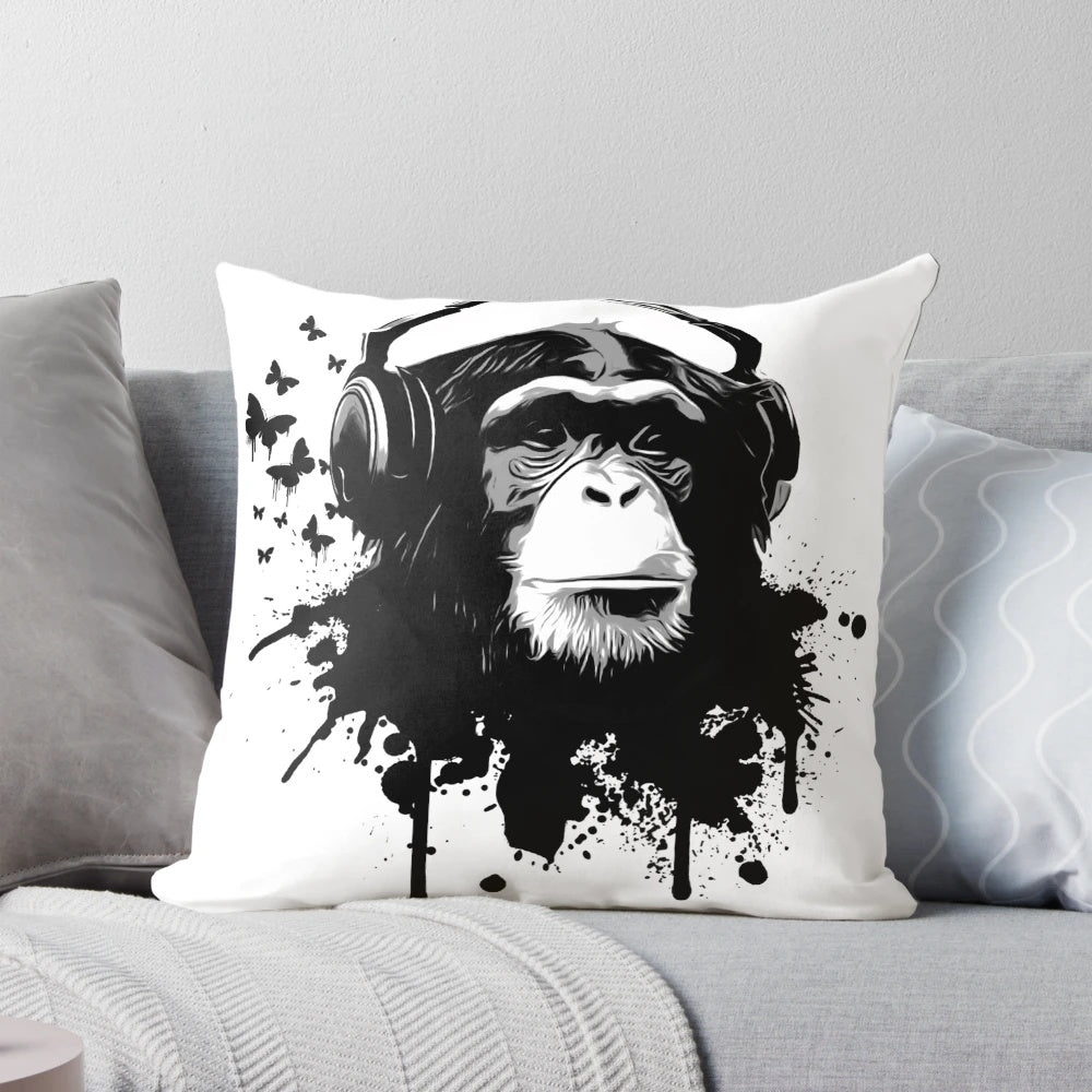 Colorful pillow featuring a vibrant monkey-inspired pattern with splashes, butterflies, and headphones