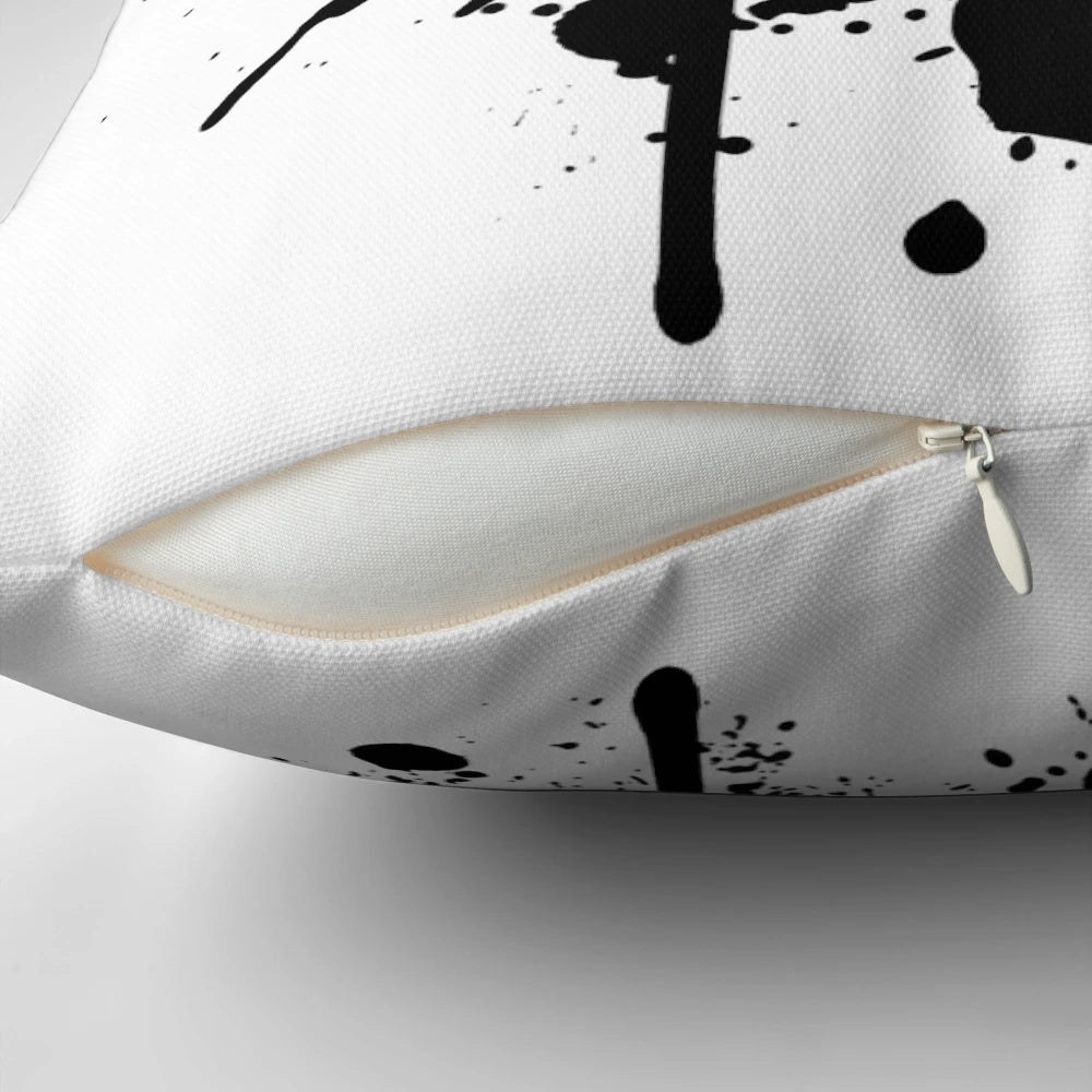 Colorful pillow featuring a vibrant monkey-inspired pattern with splashes, butterflies, and headphones