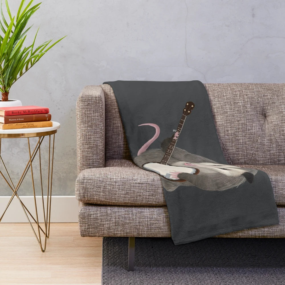 Opossum playing the banjo on a plush blanket