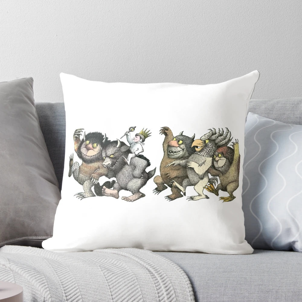 A throw pillow featuring a whimsical graphic design of the "wild things" characters.
