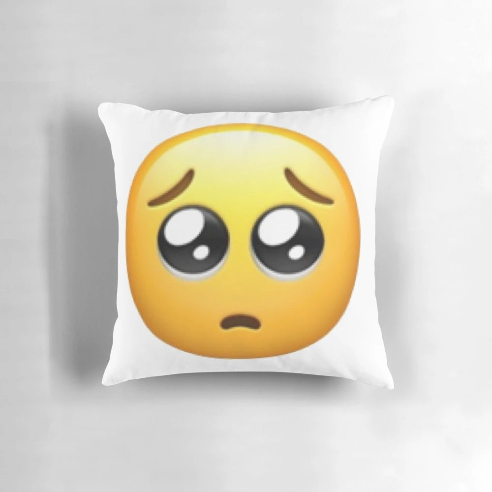 Pleading big eyes emoji printed on a soft, plush throw pillow