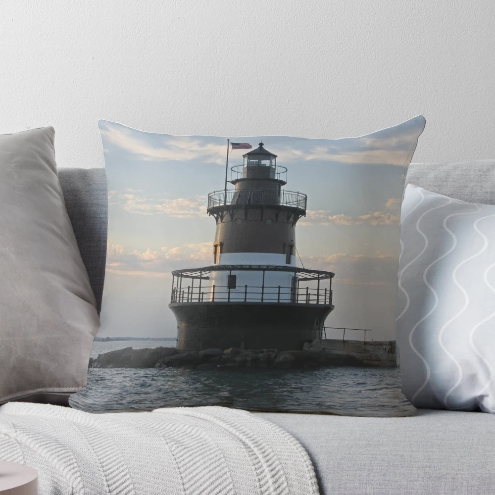 Plum Beach Light Pillow showcasing the iconic lighthouse against a scenic coastal backdrop
