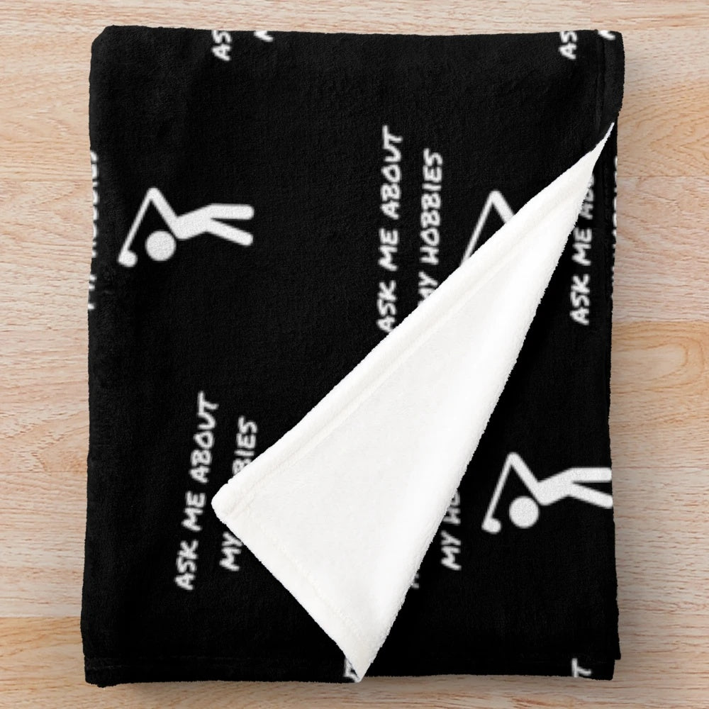 Plush blanket with "Ask Me About My Hobbies" design