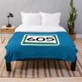 Plush blanket featuring the area code 605 and iconic South Dakota landmarks