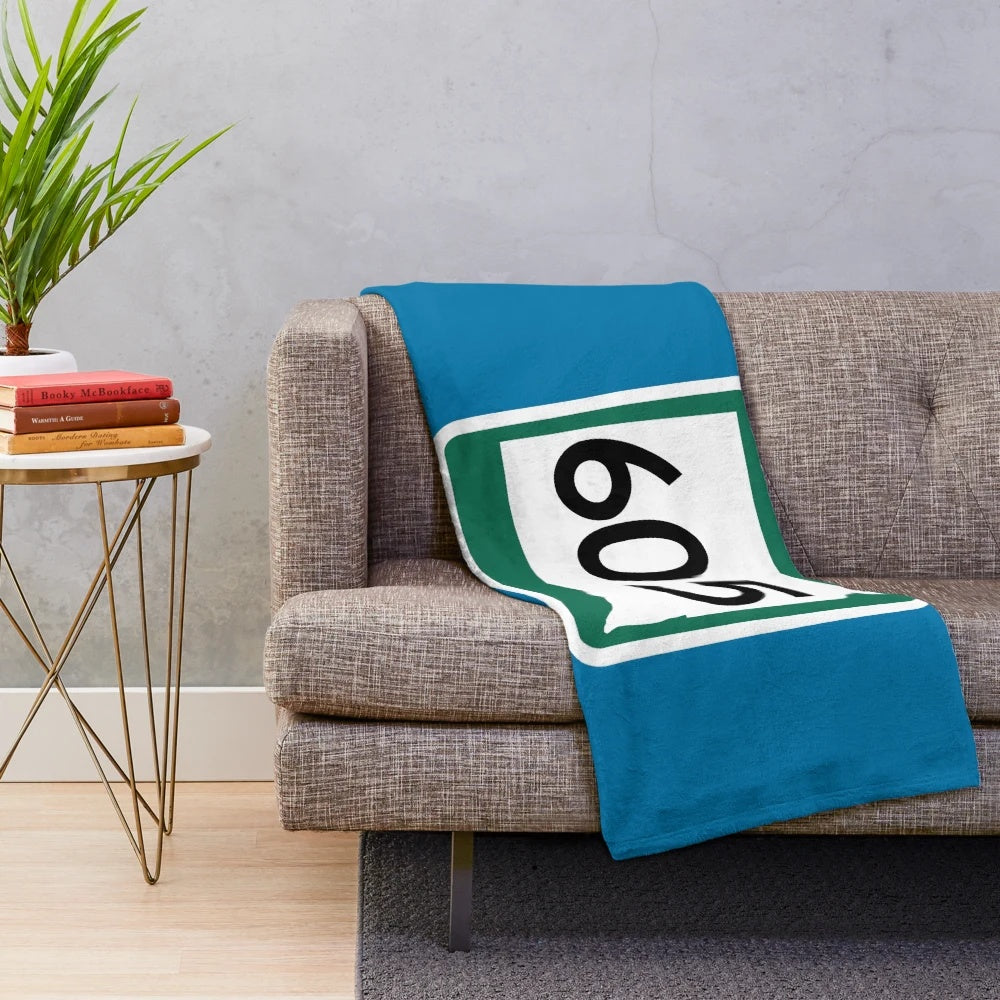 Plush blanket featuring the area code 605 and iconic South Dakota landmarks