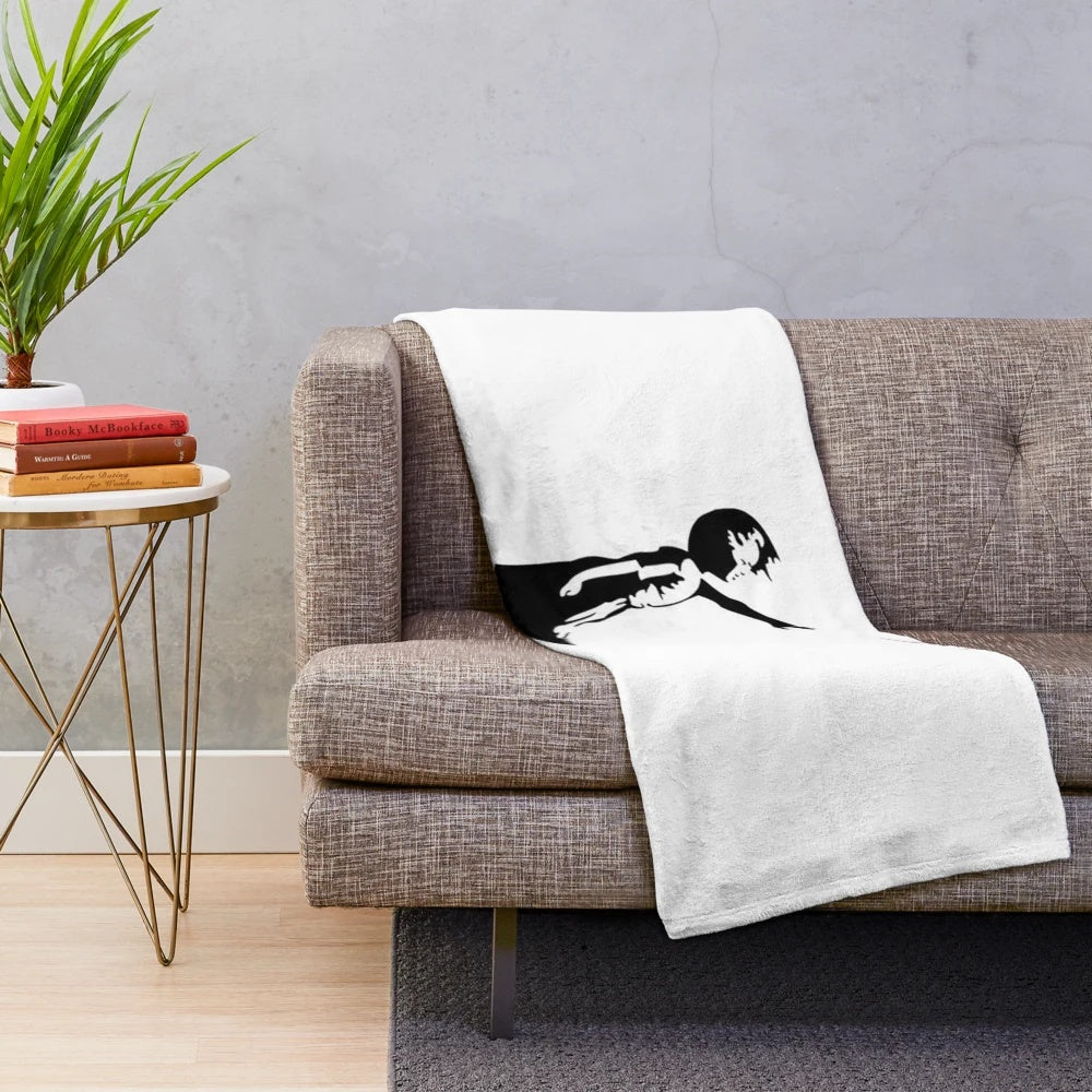 Plush blanket with Banksy's iconic Girl with Red Balloon street art design