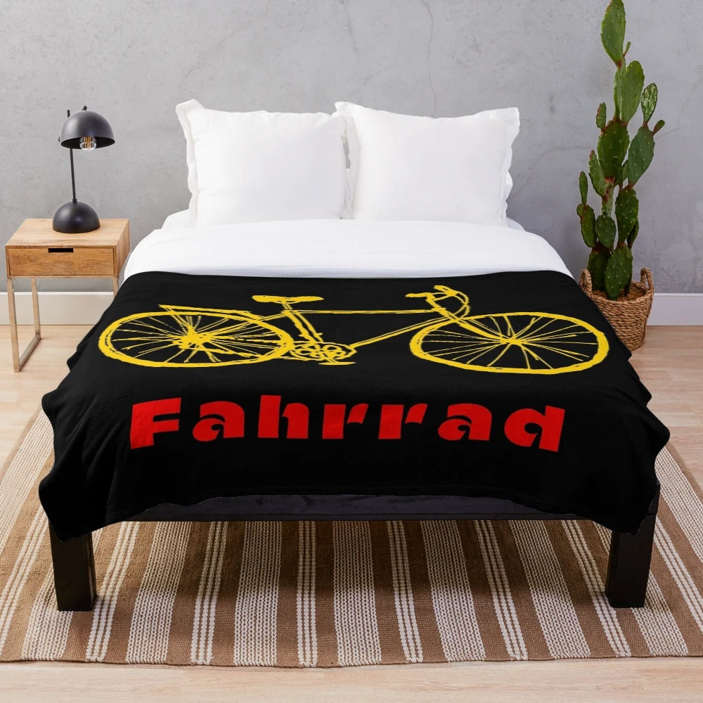 Plush blanket with a bicycle design inspired by travels in Germany