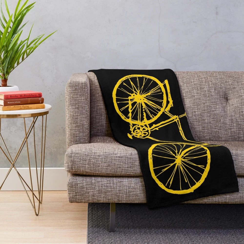 Plush blanket with a bicycle design inspired by travels in Germany