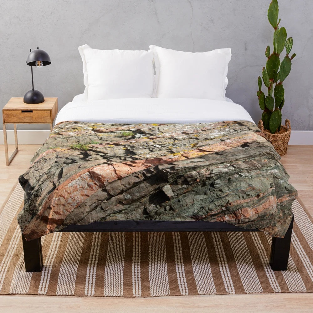 Plush blanket with print of geological formation of tilted banded rocks from the Rosemarkie Metamorphic Complex in the Scottish Highlands